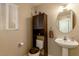 Cozy powder bathroom with wood storage and decorative vanity at 8737 Autumn Valley Ave, Las Vegas, NV 89129