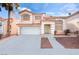 Charming two-story home featuring a two car garage, covered entry, and classic architecture at 8737 Autumn Valley Ave, Las Vegas, NV 89129