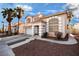 Inviting two-story home boasts stylish architecture, desert landscaping, palm trees and a two car garage at 8737 Autumn Valley Ave, Las Vegas, NV 89129