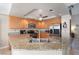 Bright kitchen featuring stainless steel appliances, tile floors, granite countertops, and ample cabinetry at 8737 Autumn Valley Ave, Las Vegas, NV 89129