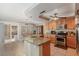 Bright kitchen featuring stainless steel appliances, tile floors, granite countertops, and center island at 8737 Autumn Valley Ave, Las Vegas, NV 89129