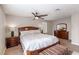 Neutral primary bedroom featuring a ceiling fan, carpeted floors, and traditional furniture at 8737 Autumn Valley Ave, Las Vegas, NV 89129