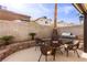 Patio with fire pit and built-in barbecue at 8737 Autumn Valley Ave, Las Vegas, NV 89129