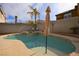 Enjoy this inviting kidney shaped pool with patio seating at 8737 Autumn Valley Ave, Las Vegas, NV 89129