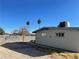 Backyard of home features palm trees and block wall fence at 1812 Ryan Ave, Las Vegas, NV 89101