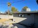 Backyard featuring palm tree and block wall, showcasing the outdoor space and landscaping at 1812 Ryan Ave, Las Vegas, NV 89101