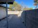 Open backyard space features a brick-paved patio against a block wall, offering privacy and space for outdoor enjoyment at 1812 Ryan Ave, Las Vegas, NV 89101