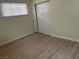Bedroom featuring wood flooring, a window with blinds, and closet at 1812 Ryan Ave, Las Vegas, NV 89101