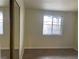 Bedroom with wood flooring, window, and closet with mirror doors at 1812 Ryan Ave, Las Vegas, NV 89101