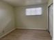 Bedroom featuring wood flooring, a window with blinds, and closet at 1812 Ryan Ave, Las Vegas, NV 89101