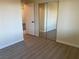 Bedroom featuring hard surface floors and a mirrored closet door at 1812 Ryan Ave, Las Vegas, NV 89101