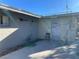 Exterior of home features easy access door to backyard and concrete foundation at 1812 Ryan Ave, Las Vegas, NV 89101