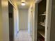 Hallway with tile floor and a storage area with multiple shelves at 1812 Ryan Ave, Las Vegas, NV 89101