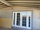 Covered patio area with outdoor access through double doors at 1812 Ryan Ave, Las Vegas, NV 89101