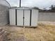 Outdoor metal shed with double doors, offering additional storage space in the backyard at 1812 Ryan Ave, Las Vegas, NV 89101