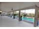 Covered outdoor living space overlooking a private pool and landscaped backyard at 427 Norridgewock St, Henderson, NV 89074