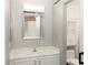Bathroom with vanity, mirrored medicine cabinet and toilet with shelves for storage at 427 Norridgewock St, Henderson, NV 89074