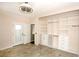 Bedroom with large built in wardrobe, neutral paint, ceiling fan, door to patio and tile floors at 427 Norridgewock St, Henderson, NV 89074