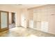 Bedroom with large built in wardrobe with a patio view, neutral paint, ceiling fan, and tile floors at 427 Norridgewock St, Henderson, NV 89074