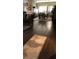 Open-concept dining area with hardwood floors, an area rug, and natural light at 427 Norridgewock St, Henderson, NV 89074