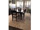 Dining room with a dark wood table, an area rug, and bright natural light at 427 Norridgewock St, Henderson, NV 89074