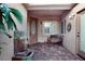 Inviting front porch featuring decorative water feature, neutral paint, and a cozy bench at 427 Norridgewock St, Henderson, NV 89074