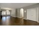 Open living area with hardwood floors, plantation shutters, and an arched doorway at 427 Norridgewock St, Henderson, NV 89074