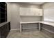 Bright office space features custom built-ins, white counters, and tile flooring for a professional workspace at 427 Norridgewock St, Henderson, NV 89074