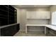 Well-appointed home office with custom shelving, work space, and bright lighting at 427 Norridgewock St, Henderson, NV 89074