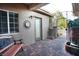 Relaxing outdoor patio space with brick pavers, seating, and a water feature at 427 Norridgewock St, Henderson, NV 89074