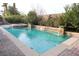 An expansive pool with brick trim, water fountains, desert landscaping and brickwork all around at 427 Norridgewock St, Henderson, NV 89074