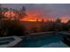 Stunning pool at sunset with vibrant sky colors reflecting on the water at 427 Norridgewock St, Henderson, NV 89074