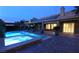 Beautiful backyard pool and spa with covered patio, solar panels, and brick patio, perfect for outdoor relaxation at 427 Norridgewock St, Henderson, NV 89074