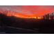 Beautiful sunset with vibrant colors over the neighborhood from home's outdoor patio at 427 Norridgewock St, Henderson, NV 89074