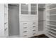Walk-in closet with custom shelving, cabinets, and drawers to keep all your items organized at 427 Norridgewock St, Henderson, NV 89074