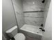 Bathroom with marble tile shower/tub combo and modern fixtures at 3810 Desert Marina Dr # 197, Laughlin, NV 89029