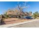 Ranch style home with mature tree and driveway parking at 4245 Seville St, Las Vegas, NV 89121