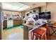 Galley style kitchen with wood cabinets and a breakfast bar at 4245 Seville St, Las Vegas, NV 89121