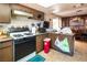 Kitchen with gas range, wood cabinets and breakfast bar at 4245 Seville St, Las Vegas, NV 89121