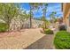 Landscaped backyard with gravel, patio, and built-in grill at 1590 Sabatini Dr, Henderson, NV 89052