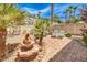 Relaxing backyard oasis with patio, fountain, and comfortable seating at 1590 Sabatini Dr, Henderson, NV 89052