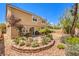 Spacious backyard with patio furniture and a stone retaining wall at 1590 Sabatini Dr, Henderson, NV 89052