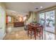 Breakfast nook adjacent to kitchen with view of living room and backyard at 1590 Sabatini Dr, Henderson, NV 89052