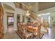 Grand dining room featuring a crystal chandelier and staircase leading to upper floor at 1590 Sabatini Dr, Henderson, NV 89052