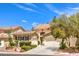 Charming two-story home with a three-car garage, tile roof, and manicured landscaping at 1590 Sabatini Dr, Henderson, NV 89052