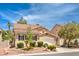 Two-story house with attached garage and landscaping at 1590 Sabatini Dr, Henderson, NV 89052