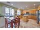 Well-appointed kitchen and breakfast nook leading to backyard with stainless appliances and granite counters at 1590 Sabatini Dr, Henderson, NV 89052