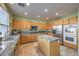 Eat-in kitchen with island, stainless steel appliances, and ample counter space at 1590 Sabatini Dr, Henderson, NV 89052