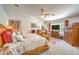 Main bedroom with large bed, dresser, and a flat-screen TV at 1590 Sabatini Dr, Henderson, NV 89052