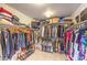 Large walk-in closet with ample shelving and hanging space at 1590 Sabatini Dr, Henderson, NV 89052